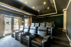 Overall view of Custom Cinema building containing a 9.2 Surround sound system home theater, with the Crestron Home Automation system